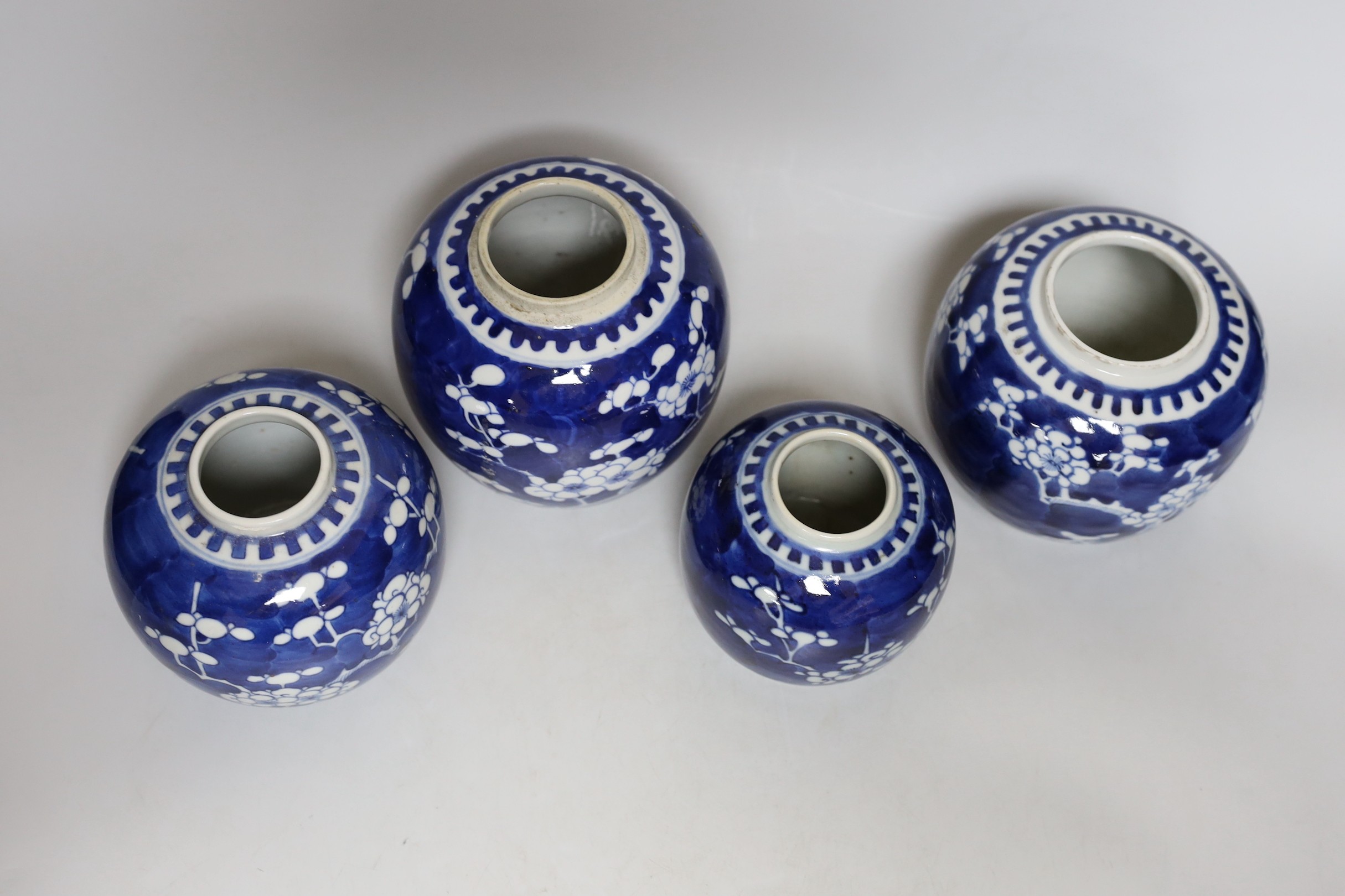 Four Chinese blue and white ‘prunus’ jars, tallest 14cms high